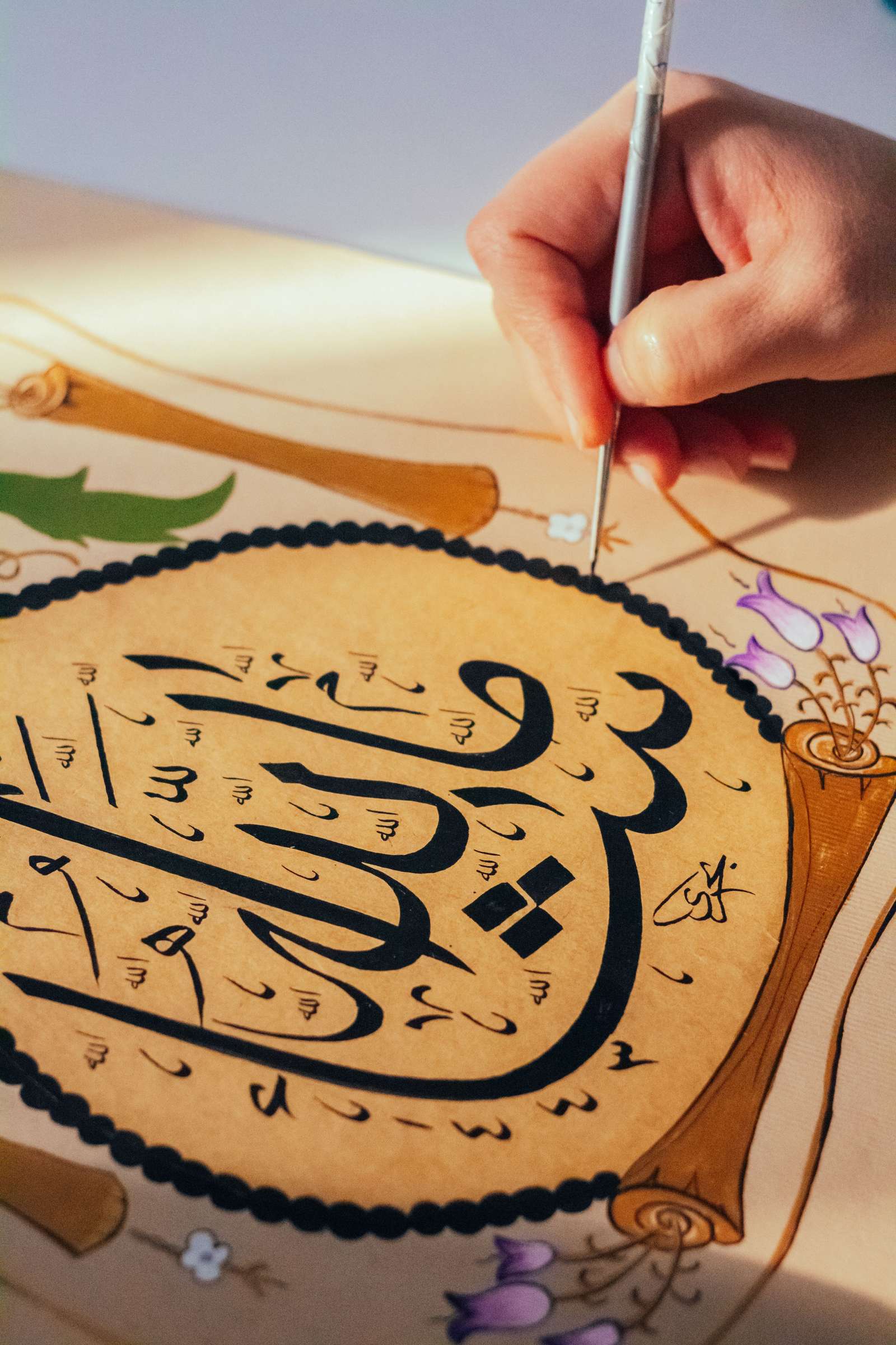 Detailed Arabic calligraphy artwork in gold