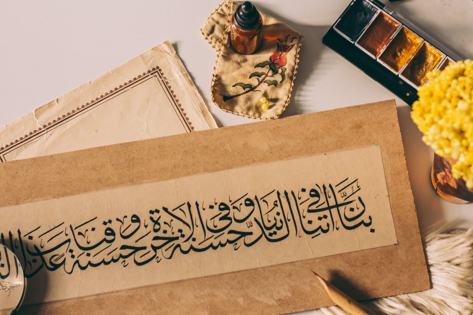 Close-up of elegant Arabic calligraphy letters on paper
