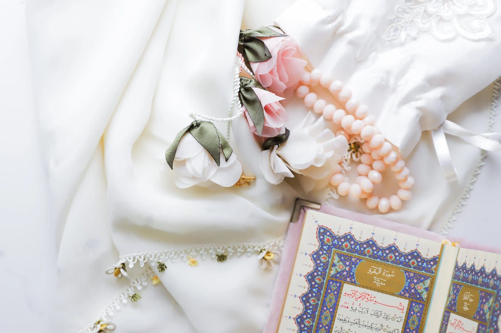 Elegant Quran still life with soft floral tones